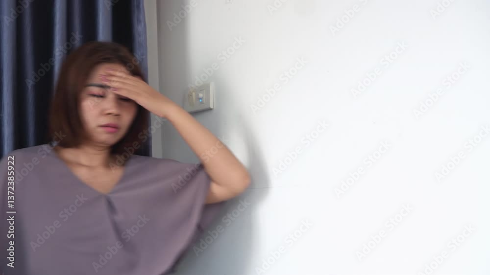 asian woman feeling tired and dizzy from anemia, suddenly experiencing vertigo, headache, and trouble balancing, possibly due to low iron, heat stroke, or blood circulation problems asian woman feeling tired and dizzy from anemia, suddenly experiencing vertigo, headache, and trouble balancing, possibly due to low iron, heat stroke, or blood circulation problems