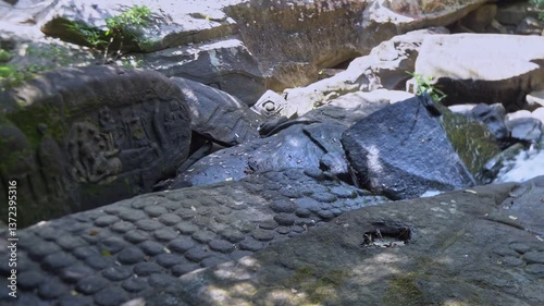 Phnom Kulen, a tranquil forest scene with a lush waterfall and soothing sounds