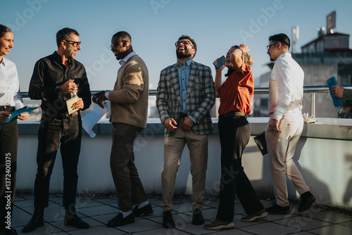 A group of multicultural business people gather on a high tower balcony, enjoying a joyful celebration under the warm sunset. Captures diversity, unity, and professional camaraderie in a vibrant