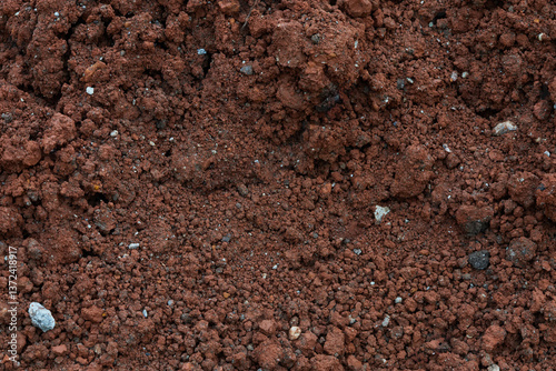 Close up Macro Shot Highlighting Rich Texture of Soil With Minerals and Small Stones in a Natural Setting