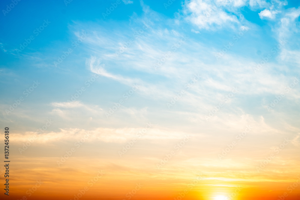 Beautiful , luxury soft gradient orange gold clouds and sunlight on the blue sky perfect for the background, take in evening,Twilight, Large size, high definition landscape photo Beautiful , luxury soft gradient orange gold clouds and sunlight on the blue sky perfect for the background, take in evening,Twilight, Large size, high definition landscape photo