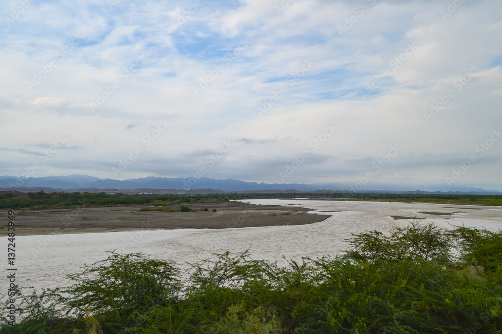 landscape with a river and clouds Turbat city