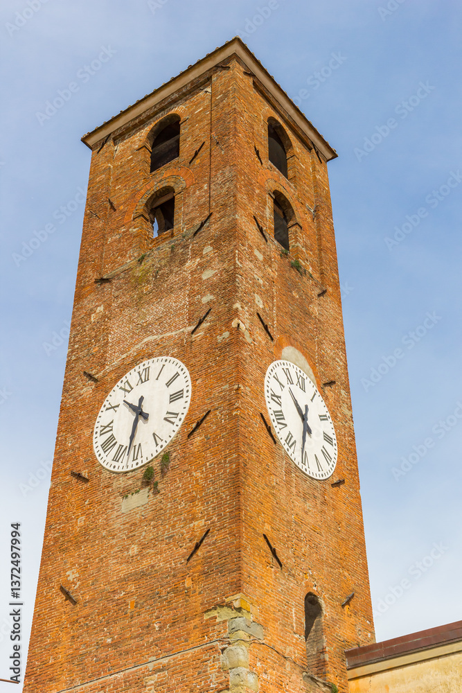 Clock tower of the historic market hall in Lucca, Italy