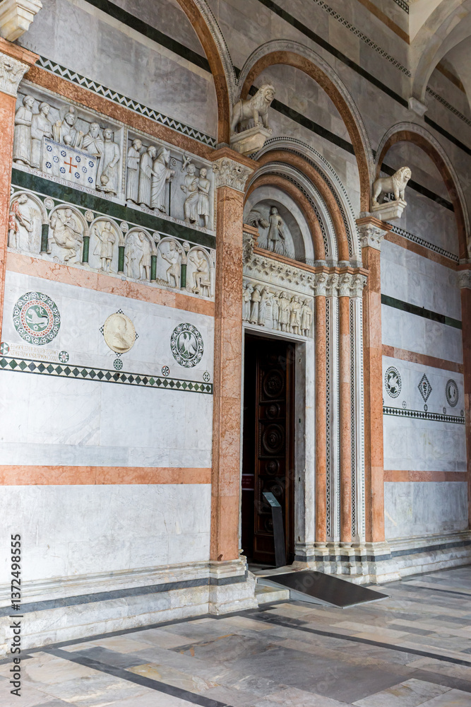 Decorated door of the historic Duomo cathedral in Lucca, Italy