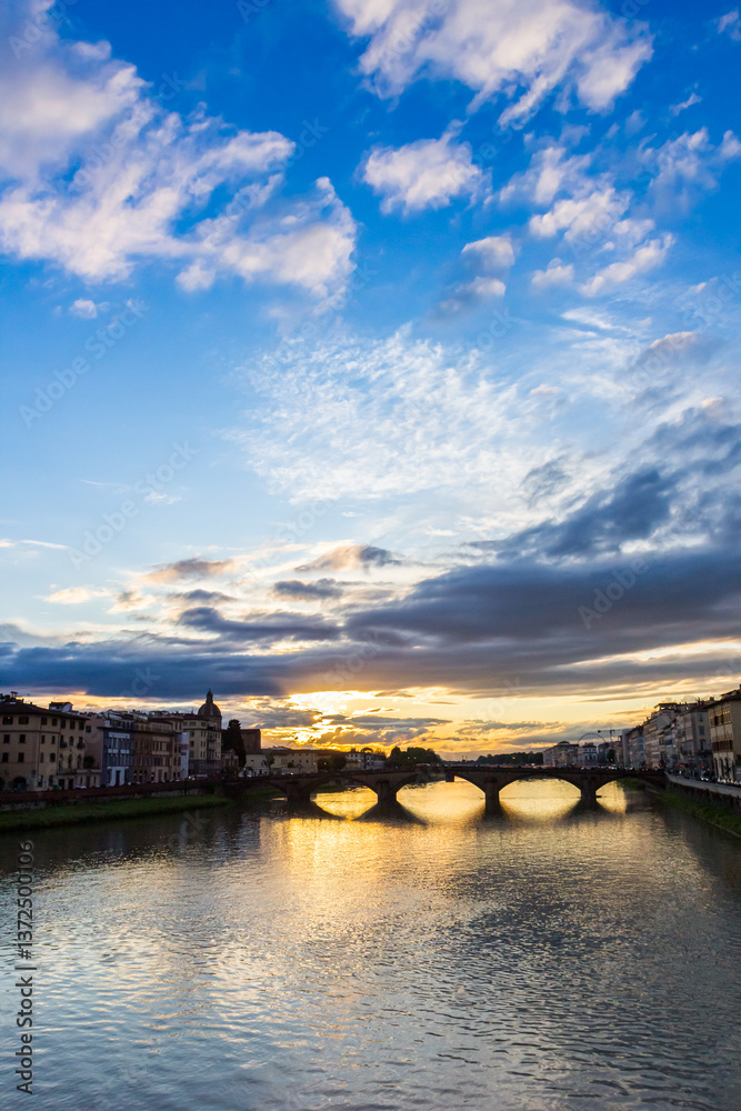 Colorful sunset over historic bridges in Florence