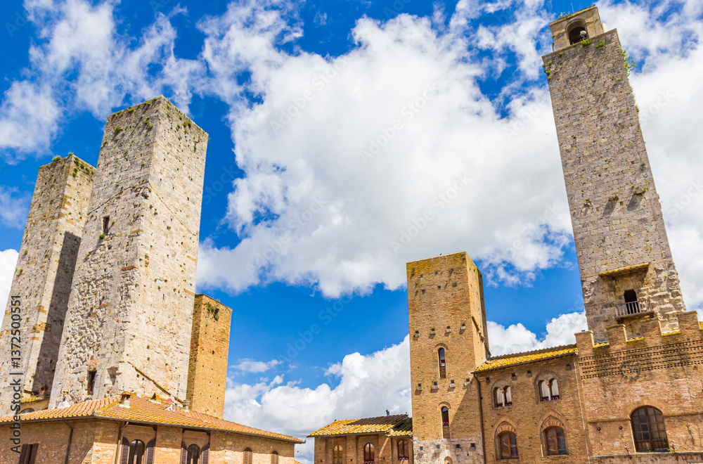 Towers and old buildings on the Piazza del Duomo of San Gimignano, Italy