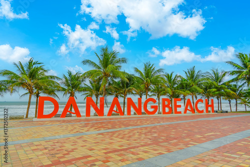 Fototapeta Naklejka Na Ścianę i Meble -  Beautiful beach palm trees row in orange Danang beach city