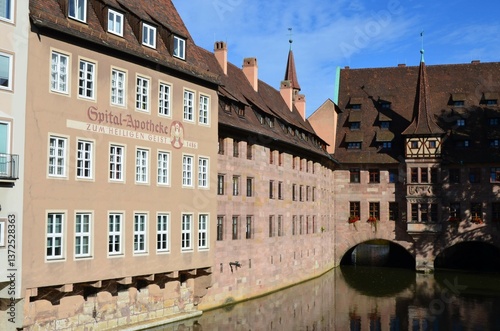 Nuremberg, Germany 10.17.2019: Hospice of the Holy Spirit (Heilig-Geist-Spital) in the center of Nuremberg on the banks of the Pegnitz river