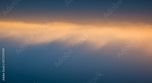 Soft, atmospheric fog rising from the bottom of the frame. The mist is illuminated by moody blue and orange lighting.