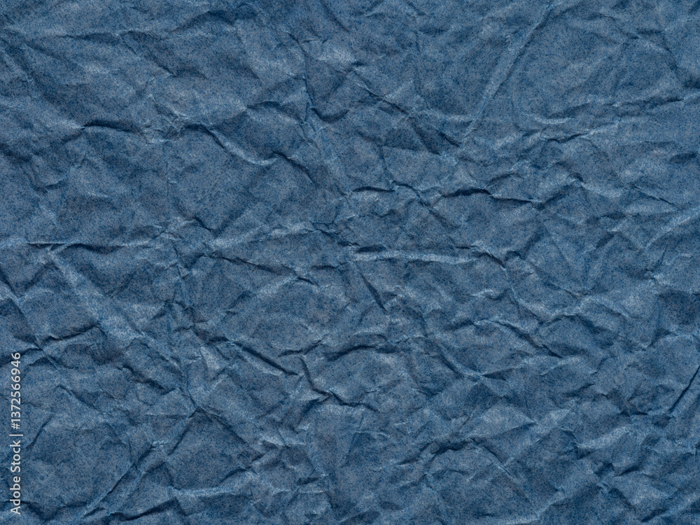 A sea of denim blue, the paper's texture tells a story of depth and rugged beauty in its folds