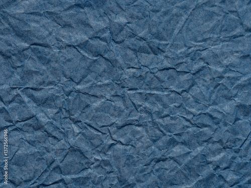Obraz na płótnie A sea of denim blue, the paper's texture tells a story of depth and rugged beauty in its folds w salonie