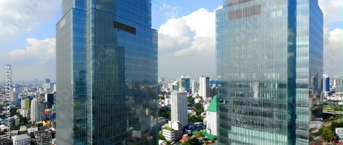 Anamorphic video of skyscraper of unparalleled height gracefully presides over the vibrant cityscape