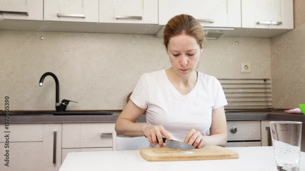 Woman cutting shrimps, culinary focus in a home kitchen, ingredient preparation for dinner. Woman cutting shrimps, culinary focus in a home kitchen, ingredient preparation for dinner.