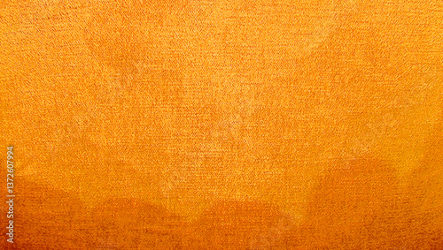 A close-up photograph showcasing the rich, vibrant texture of gold velvet fabric with a subtle gradient, suitable for use as a luxurious background or design element. yellow fabric texture.