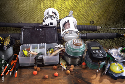 Fishing tackle on a table in a composition with fishing accessories