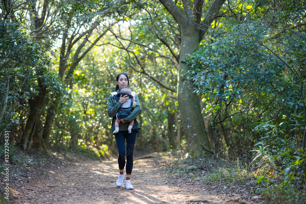Woman exploring nature with her baby