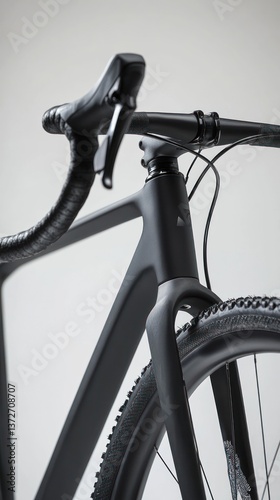 A modern all black bicycle is displayed against a white background