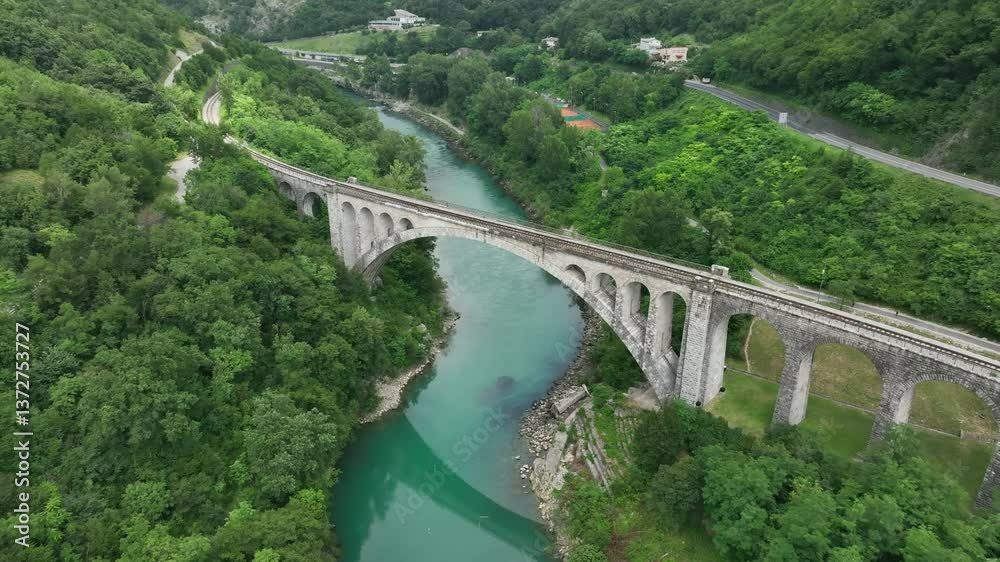 Ascending drone shot of the Solkan Bridge over the Soca River near Nova Gorica in western Slovenia Ascending drone shot of the Solkan Bridge over the Soca River near Nova Gorica in western Slovenia