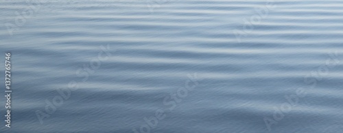 Gray blue smooth water surface as a background