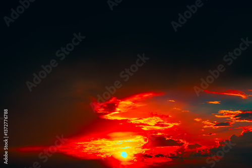Obraz na płótnie Mesmerizing sunset with sun descending near horizon, bathing sky in warm glow. Dramatic clouds painted in fiery shades of red, orange, create vivid and breathtaking contrast against deepening dusk w salonie