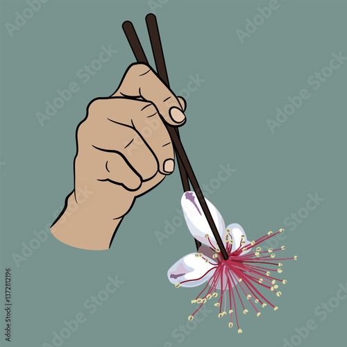Human hand holding single flower of feijoa plant with chopsticks. Creative funny vegetarian food design.