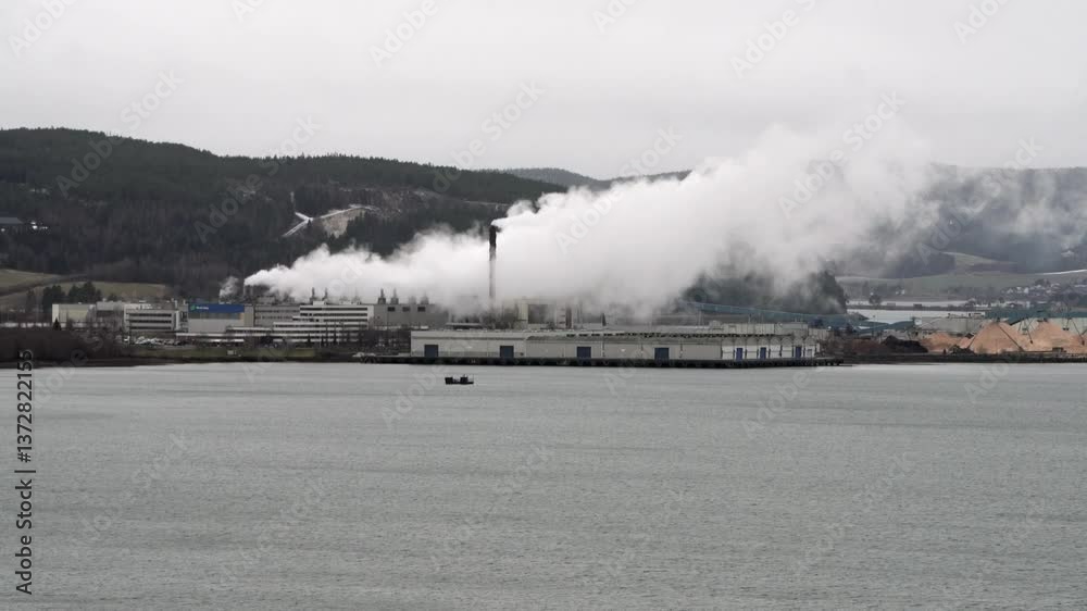 Steam rise from the chimneys of Norske Skog's manufacturing plant at Fiborgtangen, Levanger, Norway