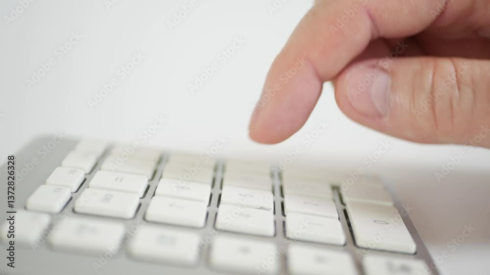 Blurred Shooting with a Businessman in the Office Making Financial Calculations Using a Computer Keypad. An employee in a Financial Corporation Using the PC Keypad. Blurred Shooting with a Businessman in the Office Making Financial Calculations Using a Computer Keypad. An employee in a Financial Corporation Using the PC Keypad.