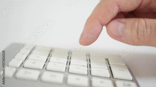 Blurred Shooting with a Businessman in the Office Making Financial Calculations Using a Computer Keypad. An employee in a Financial Corporation Using the PC Keypad. 