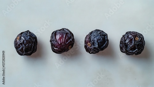 Dried Blackcurrants on a Light Surface