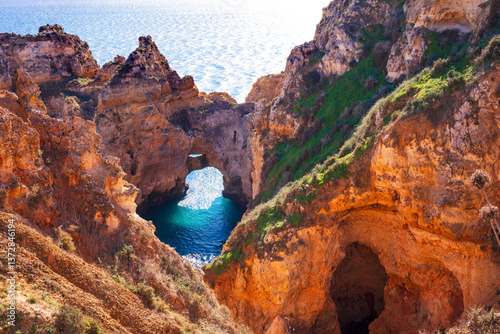 Obraz na płótnie Amazing rocky scenic becahes of Algarve coast, Portugal. Breathtaking famous beach Praia da Marinha with yellow rocks with arc . w salonie