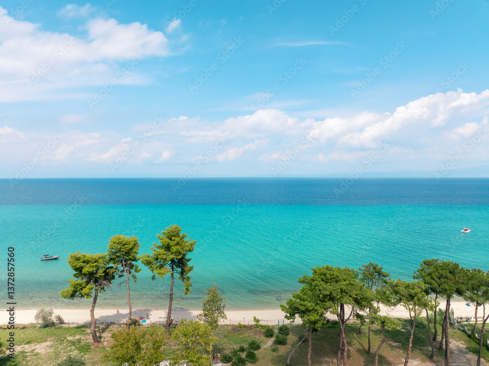 Aerial travel shot Kassandra Greece, coastal Mediterranean village, blue sea,  pine forest, summer resort atmosphere, perfect beach destination, tranquil nature scene, tourism concept. Travel