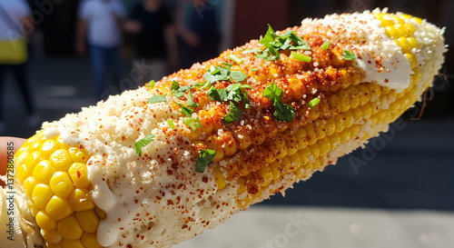 Delicious Mexican Elote with Creamy Mayo and Spicy Chili Powder, Street Food