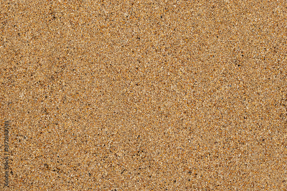 Golden beach sand texture background in the foreground Golden beach sand texture background in the foreground