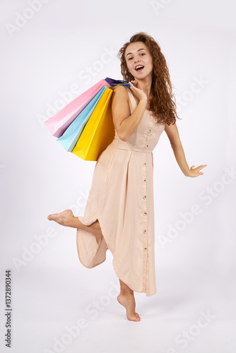 Girl with bags and purchases in a store.
