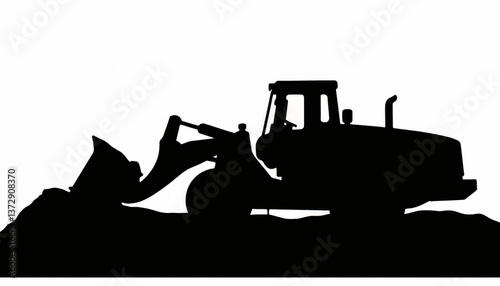 Heavy machinery excavating ground at construction site during sunset with silhouettes