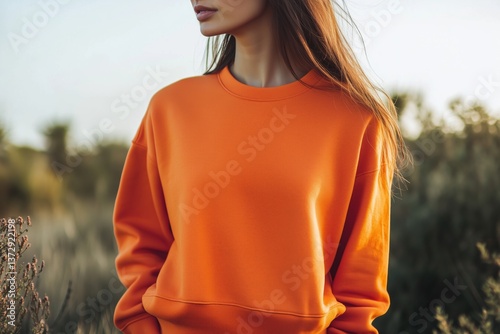 Woman in a orange sweatshirt mockup