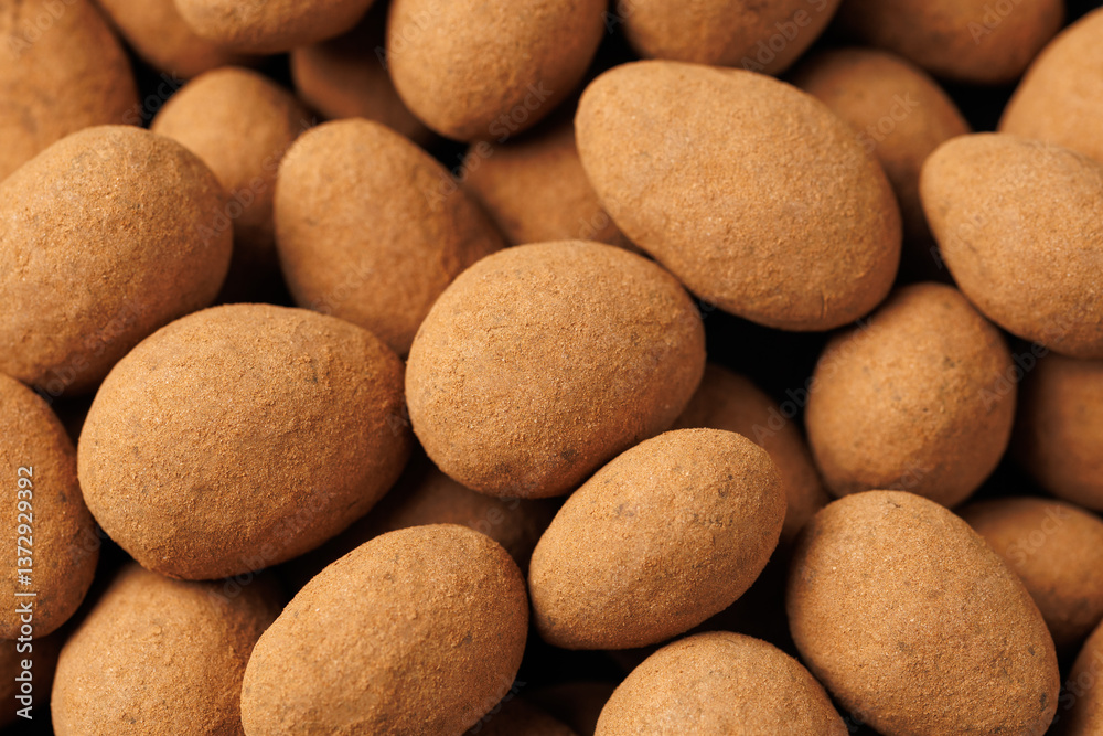Chocolate coated almonds background. Cocoa coated almonds. Cocoa Dusted Almonds Chocolate coated almonds background. Cocoa coated almonds. Cocoa Dusted Almonds