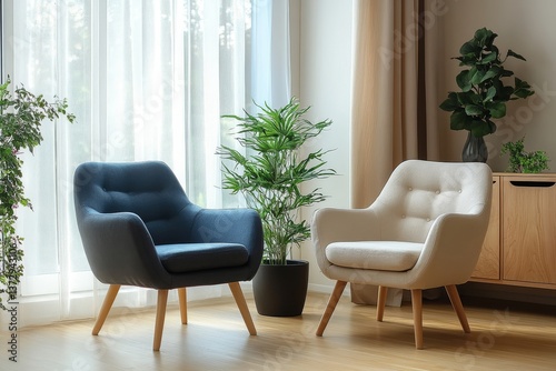 Wallpaper Mural A living room scene with two armchairs, a blue one and a beige one, and plants near a window space Torontodigital.ca