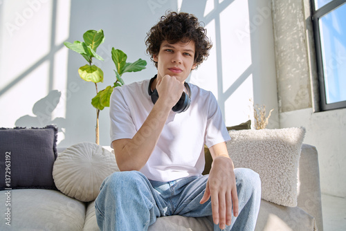 Young guy university student talking looking in web camera, at home