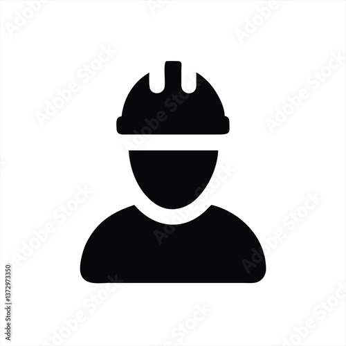 Worker wearing safety helmet engaged in construction activities