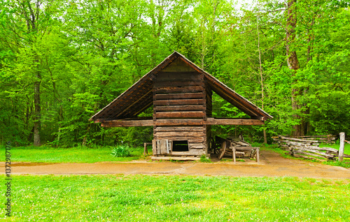 Cades Cove is a scenic valley surrounded by mountains in Great Smoky National Park near Townsend, Tennessee., with hiking trails, wildlife and historic buildings.