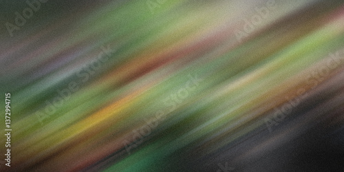 Abstract blurred background showing diagonal streaks of green brown and yellow colors on a dark surface