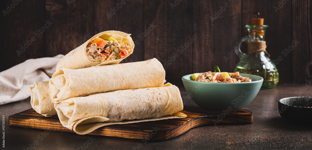 Homemade shawarma with chicken, tomato and cucumber in pita bread web banner