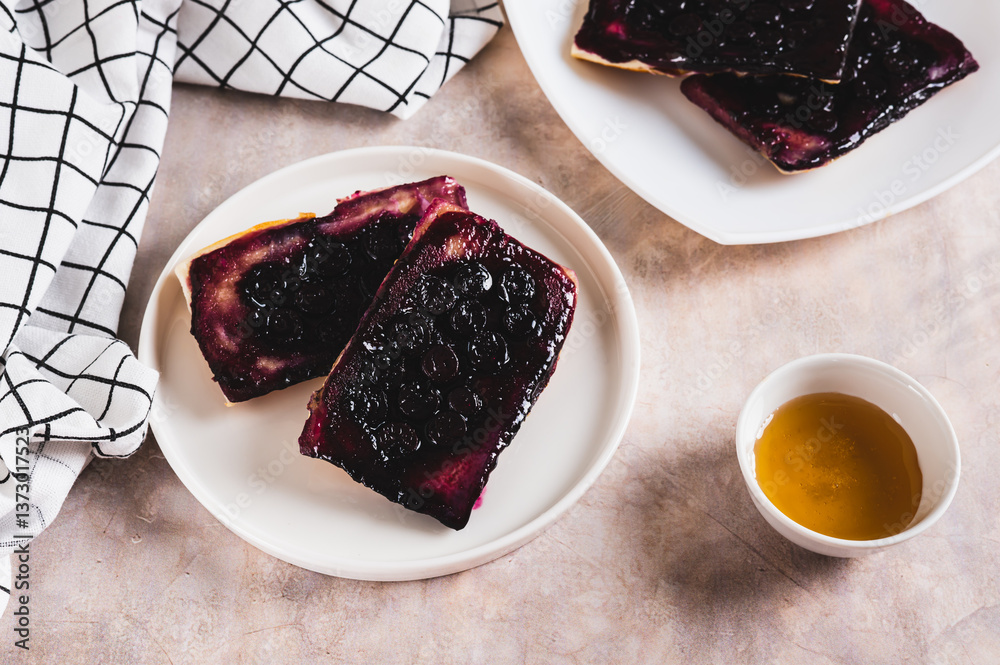 Delicious upside down berry pies on a plate on the table