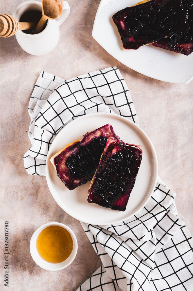 Delicious upside down berry pies on a plate on the table top and vertical view