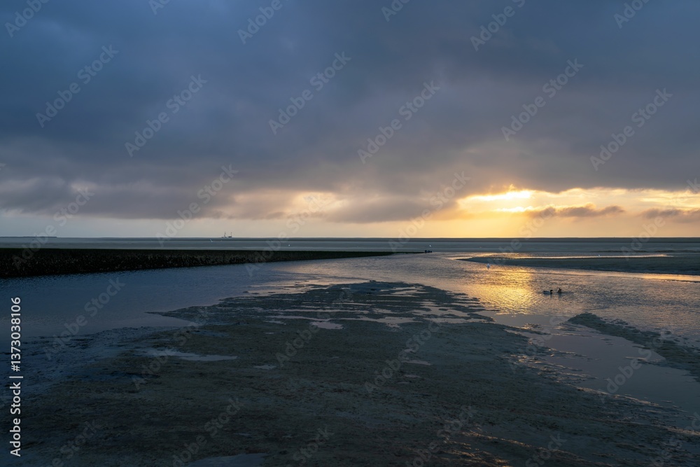 Serene beach sunset with dramatic clouds. Serene beach sunset with dramatic clouds.