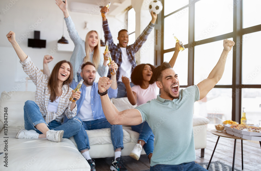 Φωτογραφία Group of young multiracial friends watching soccer game on TV with snacks and beer, cheering for favorite team, shouting GOAL at home