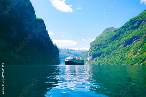 Cruise ship in the fjord. Geiranger Fjord, Norway. Traveling on a Norwegian fjord. Scandinavia. Vacation and travel in summer Norway. Background, wallpaper, postcards.