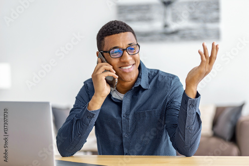 Smiling african american man talking on phone