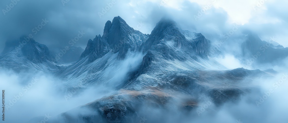 Fototapeta premium Misty mountains, serene peaks, ethereal blue hues.